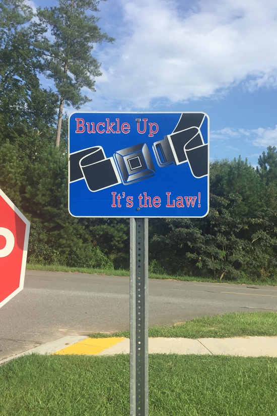 Buckle Up - It's the Law! Seat Belt/Seatbelt Metal Sign, Reflective, Pre-punched Holes, Overlaminate Option, Quality Materials for Long Life - PL-1005d